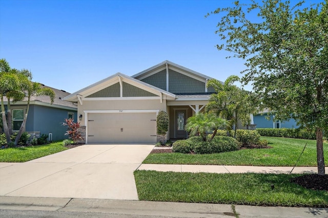 5547 Silver Sun Dr, Apollo Beach, FL 33572 - craftsman-style house featuring an attached garage, driveway, and a front lawn