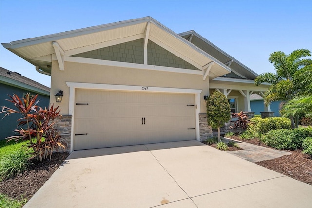 5547 Silver Sun Dr, Apollo Beach, FL 33572 - craftsman inspired home featuring stone siding, driveway, stucco siding, and an attached garage