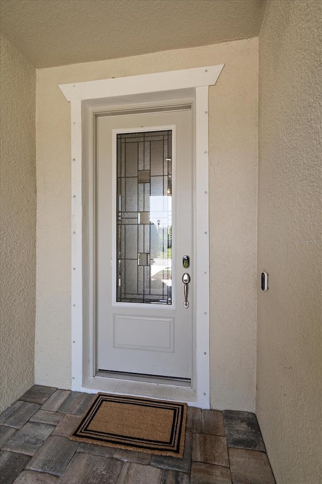 5547 Silver Sun Dr, Apollo Beach, FL 33572 - view of exterior entry with stucco siding