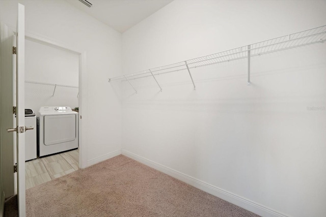 5547 Silver Sun Dr, Apollo Beach, FL 33572 - spacious closet featuring washer and clothes dryer and light carpet