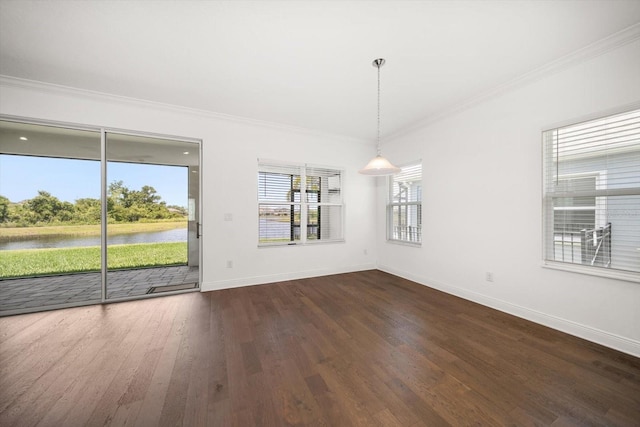 5547 Silver Sun Dr, Apollo Beach, FL 33572 - unfurnished dining area with a water view, dark wood-type flooring, crown molding, and baseboards