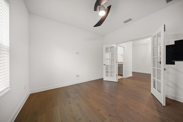 5547 Silver Sun Dr, Apollo Beach, FL 33572 - unfurnished bedroom with french doors, dark wood-style flooring, baseboards, ceiling fan, and vaulted ceiling