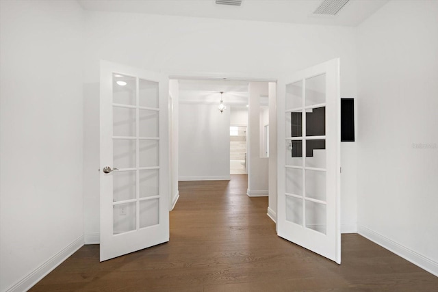 5547 Silver Sun Dr, Apollo Beach, FL 33572 - hallway with dark wood-type flooring, french doors, and baseboards