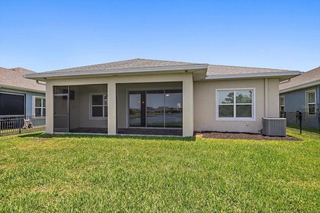 5547 Silver Sun Dr, Apollo Beach, FL 33572 - back of house featuring central air condition unit, stucco siding, a sunroom, and roof with shingles