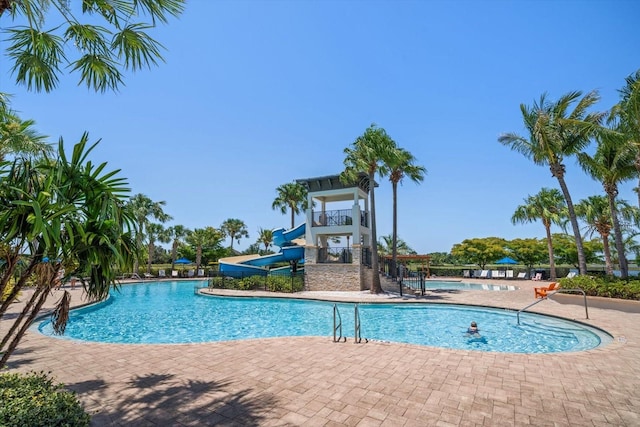5547 Silver Sun Dr, Apollo Beach, FL 33572 - community pool with a water slide and a patio