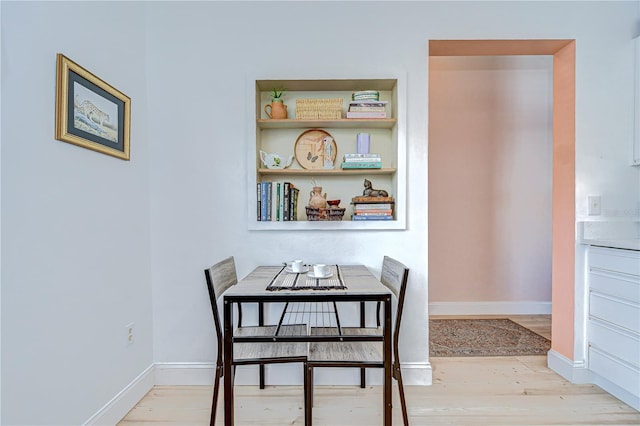 2139 Elm St Unit 308, Dunedin, FL 34698 - dining room with wood finished floors and baseboards