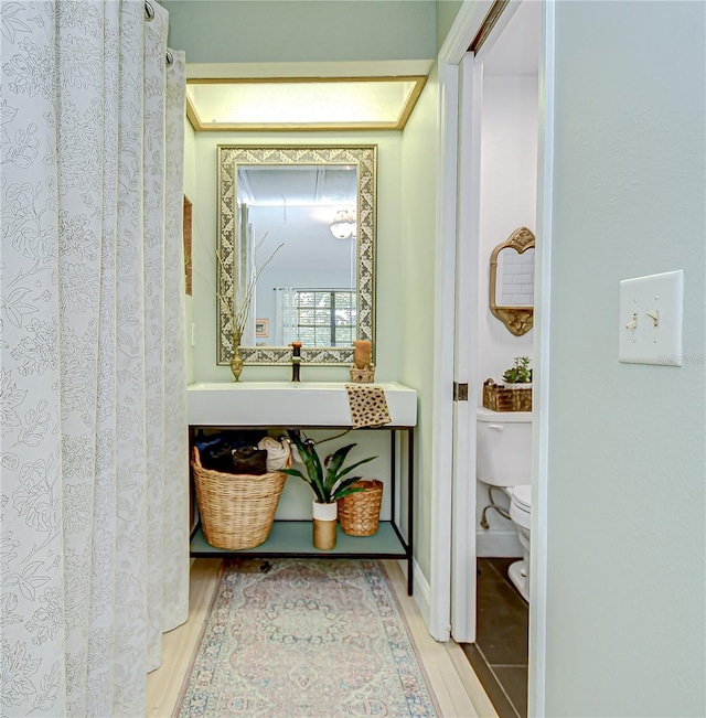 2139 Elm St Unit 308, Dunedin, FL 34698 - hall featuring wood finished floors