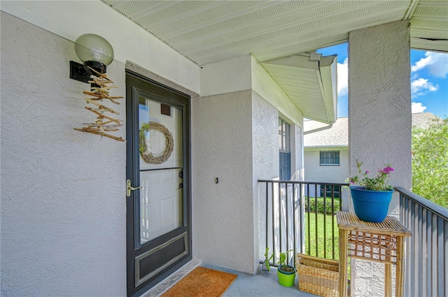 2139 Elm St Unit 308, Dunedin, FL 34698 - entrance to property featuring stucco siding and a balcony