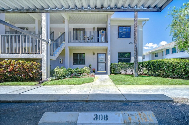 2139 Elm St Unit 308, Dunedin, FL 34698 - entrance to property with stucco siding