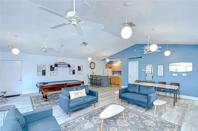 2139 Elm St Unit 308, Dunedin, FL 34698 - living room with light wood-style flooring, ceiling fan, baseboards, billiards, and lofted ceiling