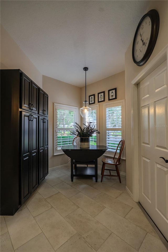 dining area featuring baseboards