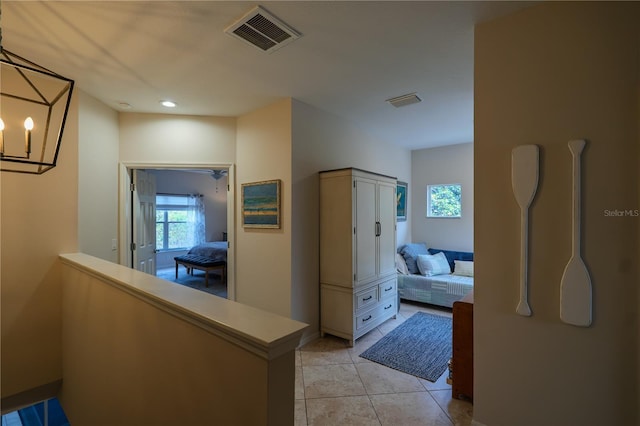 hall with light tile patterned floors and recessed lighting