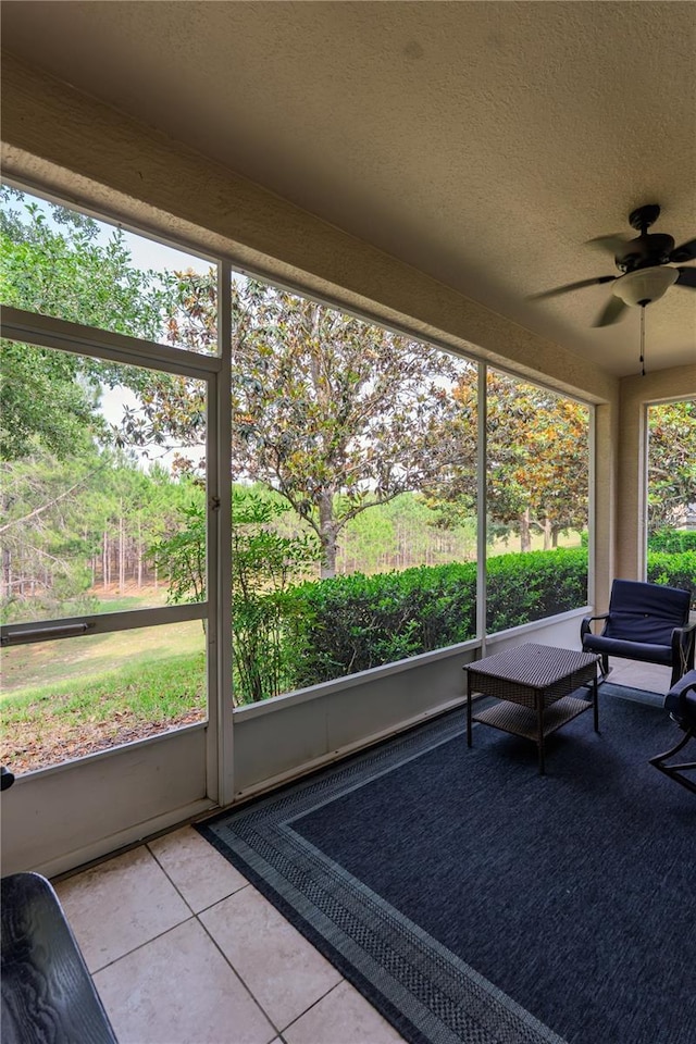 sunroom with a ceiling fan