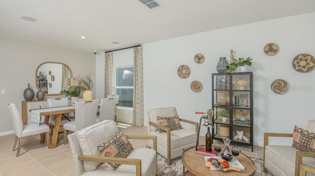 2415 Slippery Rock St, Auburndale, FL 33823 - living area featuring light tile patterned flooring, baseboards, and recessed lighting