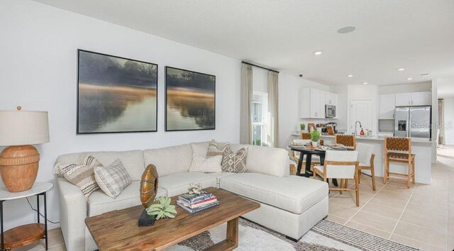 2415 Slippery Rock St, Auburndale, FL 33823 - living room featuring light tile patterned floors and recessed lighting