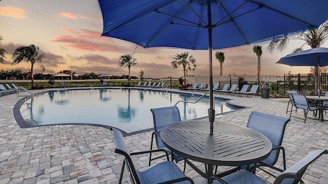 2415 Slippery Rock St, Auburndale, FL 33823 - community pool featuring fence, outdoor dining area, and a patio