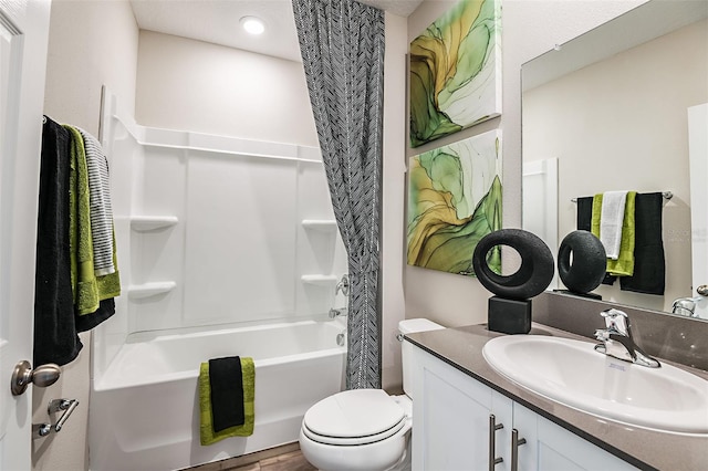 full bathroom with toilet, shower / bath combo with shower curtain, and vanity