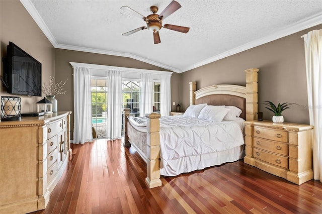 16804 Windsor Park Dr, Lutz, FL 33549 - bedroom featuring access to exterior, dark wood-type flooring, vaulted ceiling, a textured ceiling, and a ceiling fan