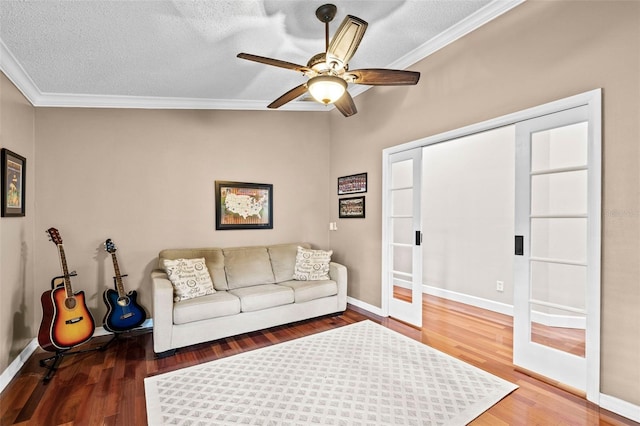 16804 Windsor Park Dr, Lutz, FL 33549 - living area with crown molding, wood finished floors, a ceiling fan, a textured ceiling, and baseboards