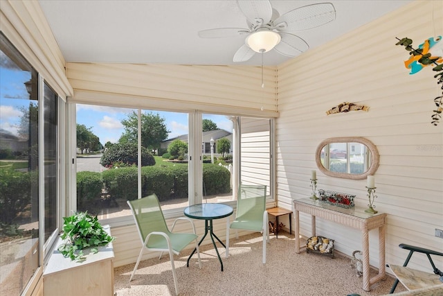 2121 Escobar Ave, Lady Lake, FL 32159 - sunroom / solarium with ceiling fan, speckle patterned floor, and wooden walls