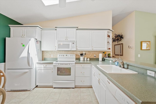 2121 Escobar Ave, Lady Lake, FL 32159 - kitchen featuring white appliances, lofted ceiling, a sink, tasteful backsplash, and open shelves