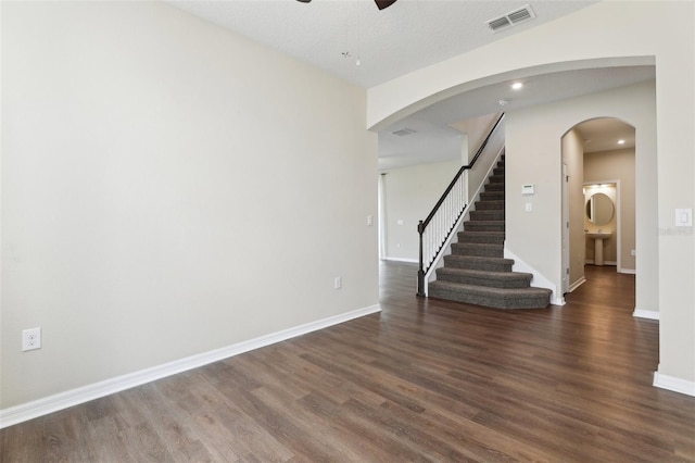 392 Summer Squall Rd, Davenport, FL 33837 - spare room featuring ceiling fan, dark wood-type flooring, baseboards, stairway, and recessed lighting