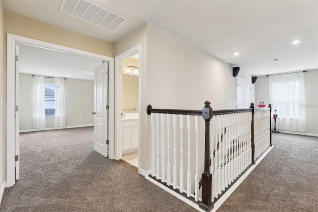 392 Summer Squall Rd, Davenport, FL 33837 - hall featuring carpet flooring, an upstairs landing, plenty of natural light, recessed lighting, and baseboards