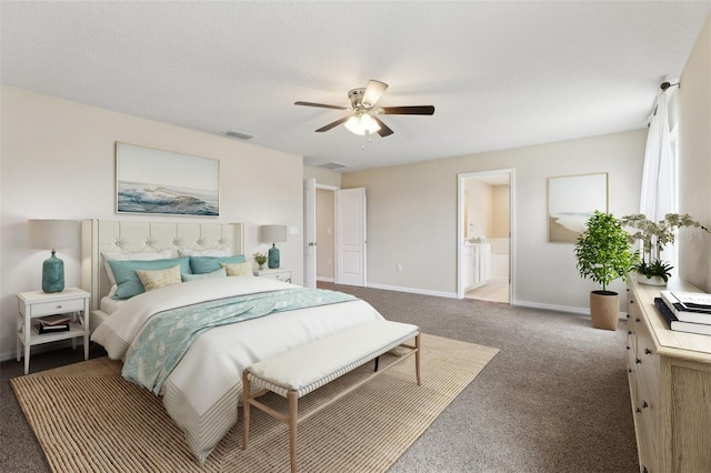 392 Summer Squall Rd, Davenport, FL 33837 - bedroom featuring carpet flooring, baseboards, ceiling fan, and connected bathroom