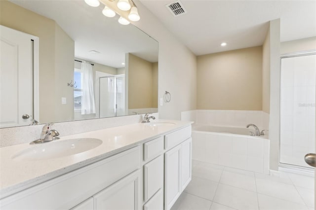 392 Summer Squall Rd, Davenport, FL 33837 - full bath featuring a stall shower, tile patterned floors, a garden tub, and double vanity