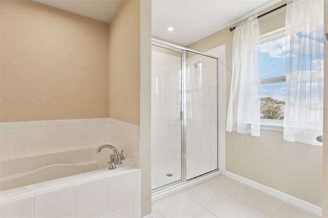 392 Summer Squall Rd, Davenport, FL 33837 - bathroom featuring a stall shower, a garden tub, tile patterned flooring, and plenty of natural light