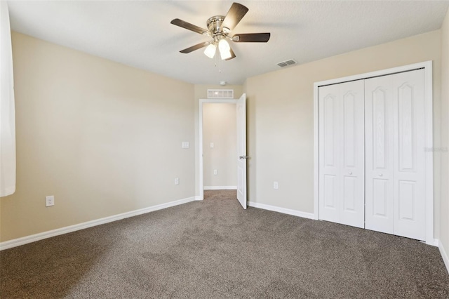 392 Summer Squall Rd, Davenport, FL 33837 - unfurnished bedroom with carpet, a closet, baseboards, and a ceiling fan