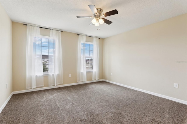 392 Summer Squall Rd, Davenport, FL 33837 - empty room with carpet flooring, ceiling fan, baseboards, and a textured ceiling