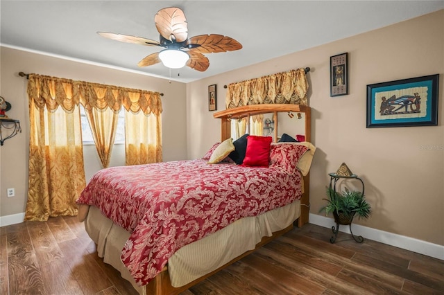 bedroom with baseboards, wood finished floors, and a ceiling fan