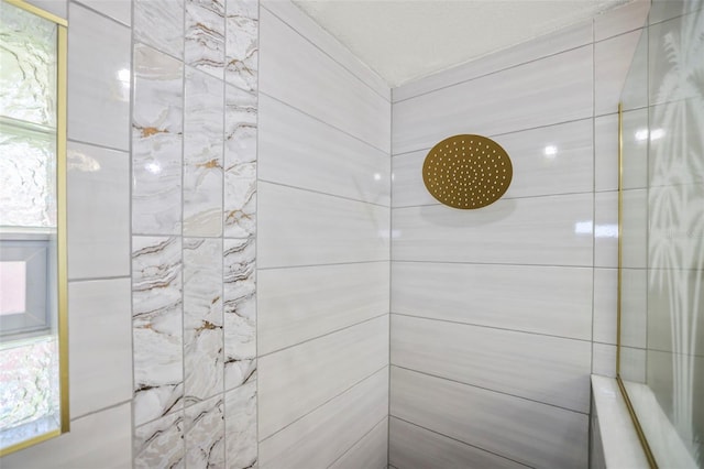 bathroom with tiled shower