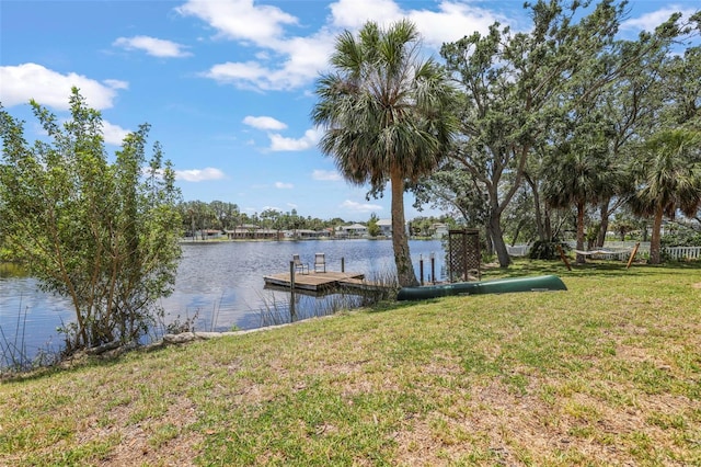 dock area featuring a yard and a water view