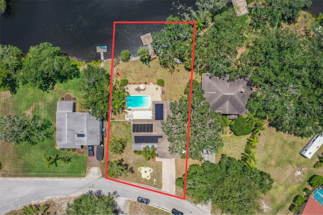 aerial view of property's location featuring a pool and property parcel outlined