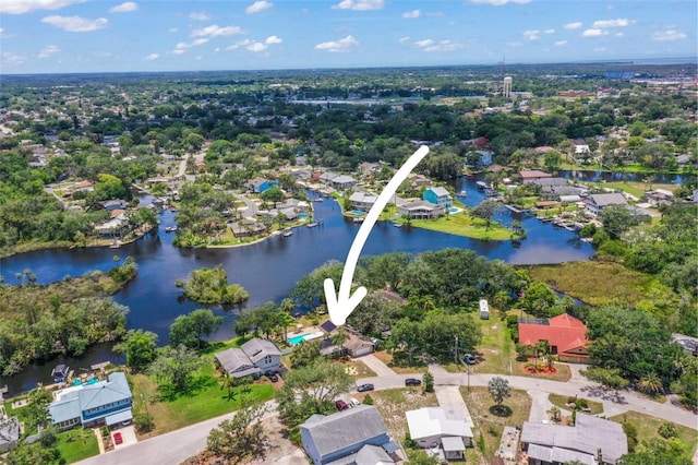 aerial perspective of suburban area with a large body of water