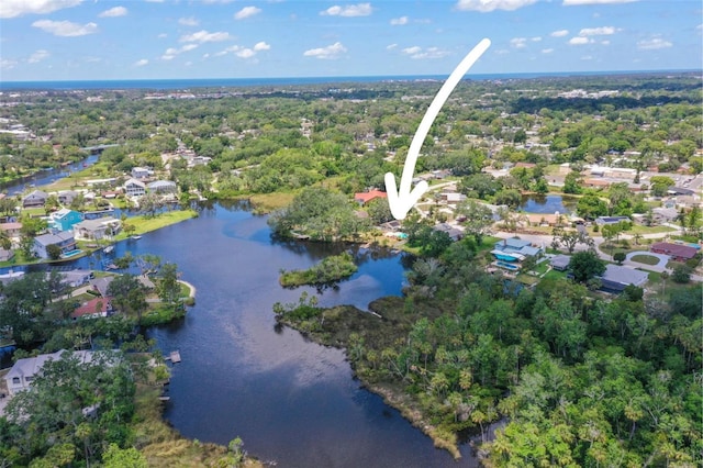 aerial perspective of suburban area featuring a nearby body of water