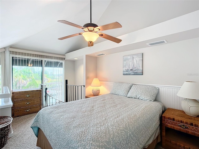 2695 N Seabreeze Pt Unit I1, Crystal River, FL 34429 - carpeted bedroom with lofted ceiling, a wainscoted wall, access to outside, and a ceiling fan