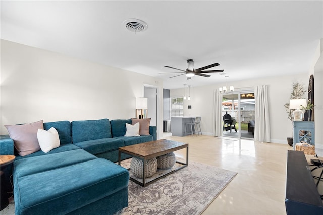1489 77th Ave N, Saint Petersburg, FL 33702 - living room with a ceiling fan, finished concrete flooring, and baseboards