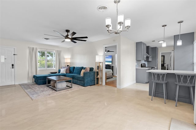 1489 77th Ave N, Saint Petersburg, FL 33702 - living room featuring a ceiling fan, a chandelier, baseboards, and concrete flooring
