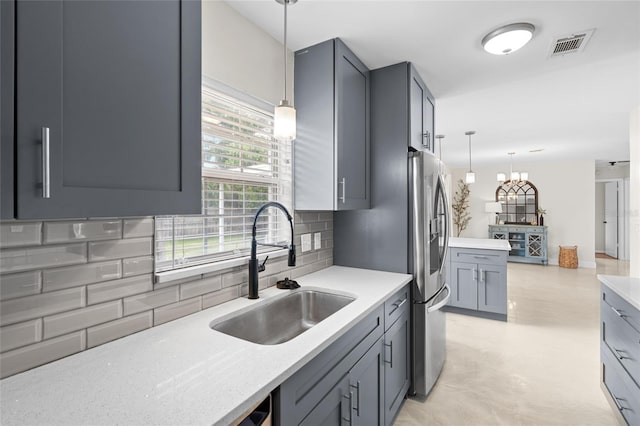1489 77th Ave N, Saint Petersburg, FL 33702 - kitchen featuring a sink, tasteful backsplash, pendant lighting, and gray cabinetry
