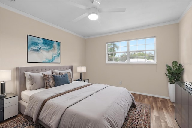 1489 77th Ave N, Saint Petersburg, FL 33702 - bedroom with ornamental molding, light wood-style flooring, baseboards, and a ceiling fan