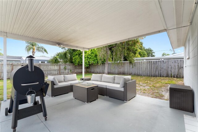 1489 77th Ave N, Saint Petersburg, FL 33702 - view of patio featuring an outdoor hangout area and a fenced backyard