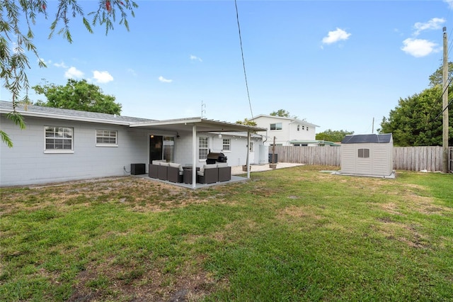 1489 77th Ave N, Saint Petersburg, FL 33702 - back of property featuring outdoor lounge area, a patio, a storage shed, and an outbuilding