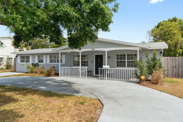 1489 77th Ave N, Saint Petersburg, FL 33702 - ranch-style home with covered porch, fence, and driveway