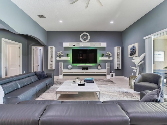 16220 Lake Armistead Way, Odessa, FL 33556 - living room featuring a ceiling fan, baseboards, recessed lighting, and arched walkways