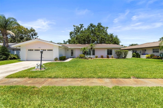 ranch-style house with a garage, concrete driveway, and a front lawn
