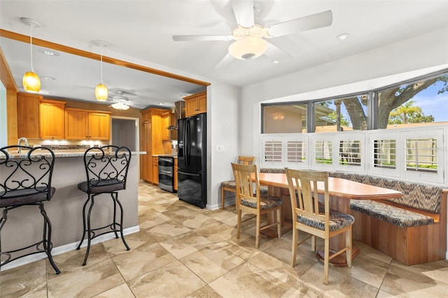 dining area featuring a ceiling fan, recessed lighting, baseboards, and breakfast area