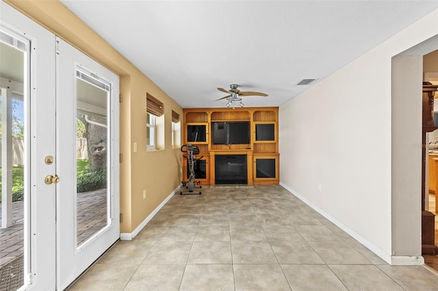 unfurnished sunroom with french doors